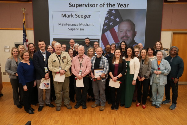 large group of people celebrating awards