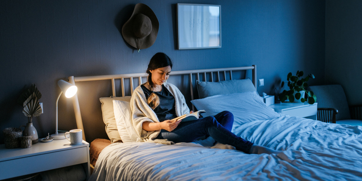 A Veteran sits in bed reading