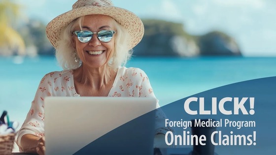Senior woman using laptop by the sea, promoting online claims for a foreign medical program.