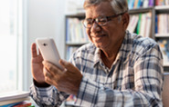 Male Veteran looking at their phone
