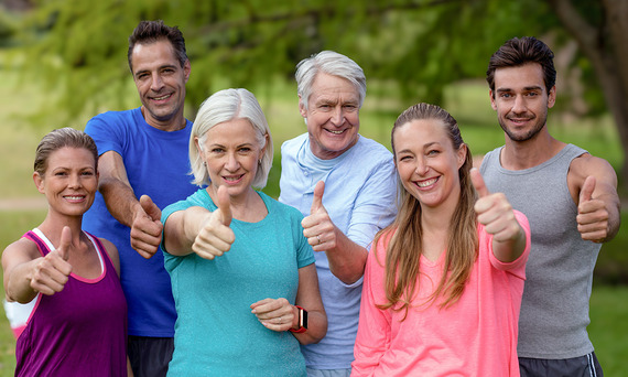 Group of people giving a thumbs up.