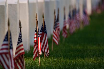 American flags at grave sites.