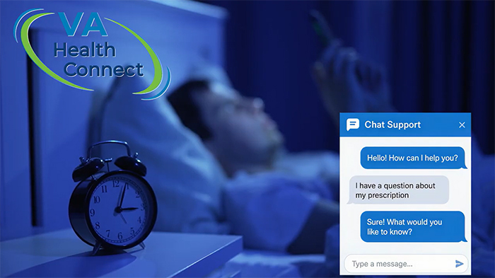 A man lays in bed late at night while checking his phone.