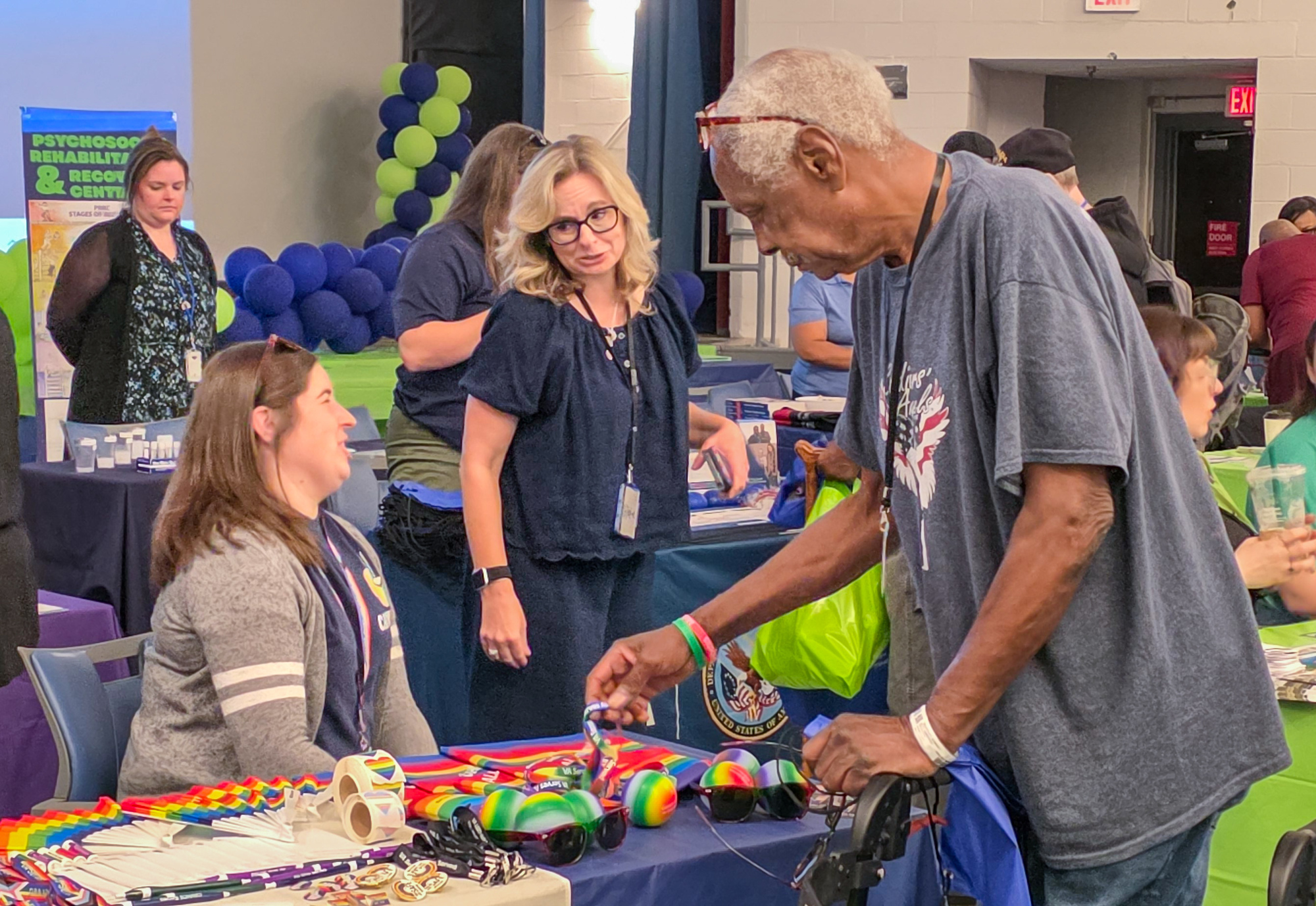 Veterans, staff and community partners connect during a mental health outreach fair at the Tuskegee Campus theater.