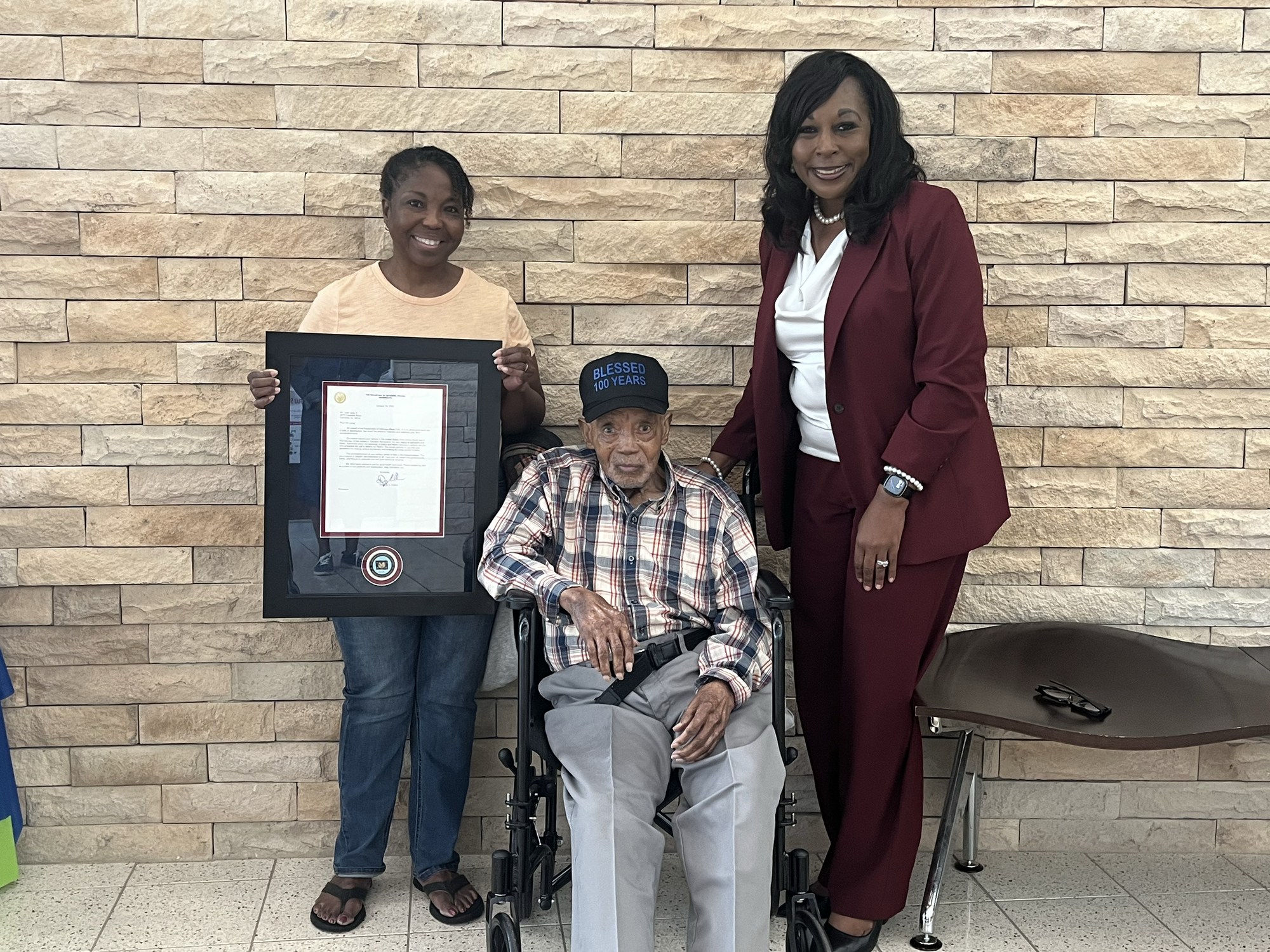 World War II Veteran Jack Long Jr. with his daughter, Yolanda Brown, and son-in-law, Derrick Brown.