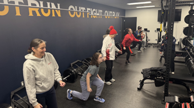 Women Veterans participate in a guided strength training session with Rhode Island FC pro soccer players. 