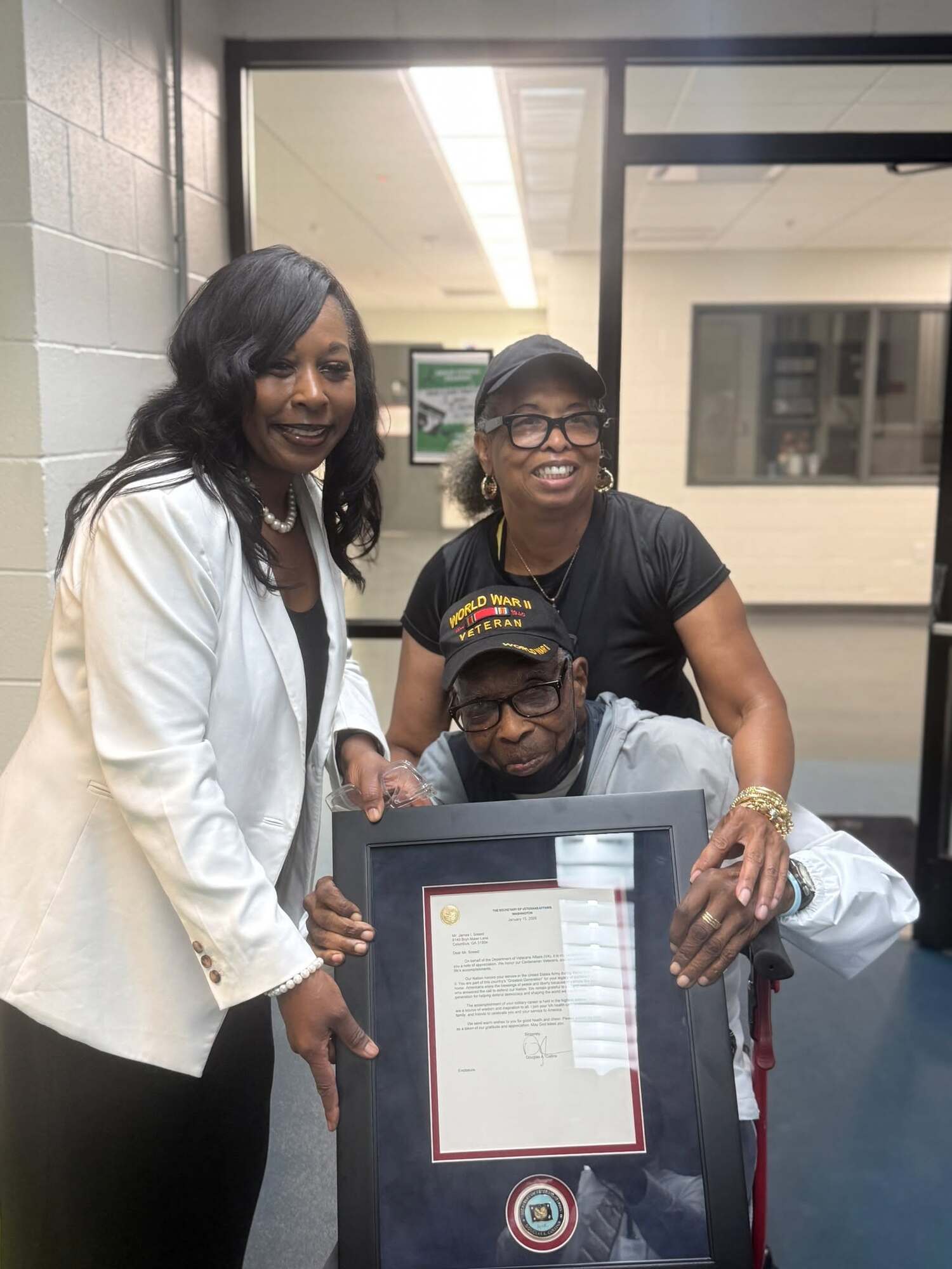 CAVHCS Interim Director and CEO Laundrena LaPradd-Bradley and Dr. Janet Sneed recognize World War II Veteran James Sneed.