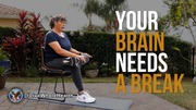 Woman seated on a chair outdoors practicing meditation with text 'Your brain needs a break'.