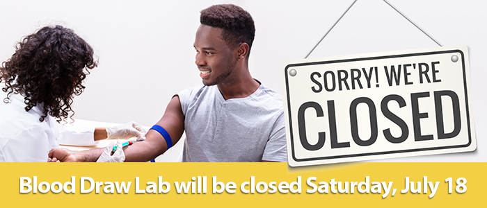 A young man gets his blood drawn by a medical professional in a lab setting with a Closed sign. Blood draw lab will be closed Saturday, July 18.