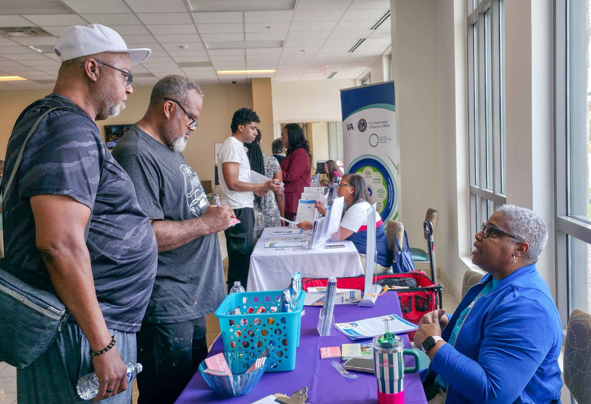Veterans speak with VA representatives during the Vet Fest Resource Fair at the Montgomery VA Clinic.