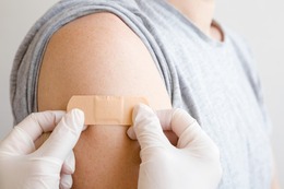 Band-Aid on Veteran's arm after receiving a flu shot.