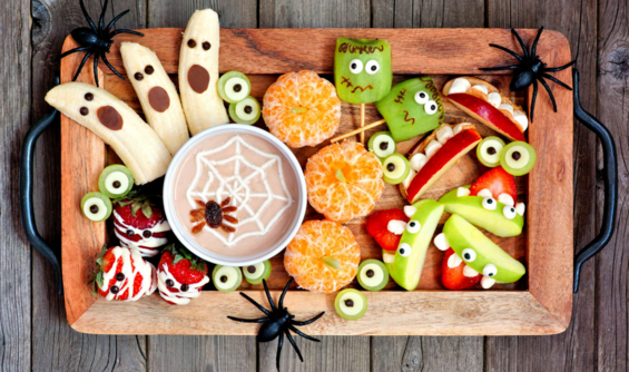 plate full of Halloween decorated fruit 