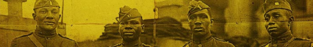 Sepia-toned photograph of 4 soldiers standing in a row