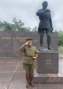 Taps bugler at the Pershing Memorial statue