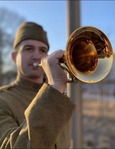 Doughboy Foundation bugler Kevin Paul plays Taps