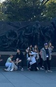 school group at memorial sculpture snip