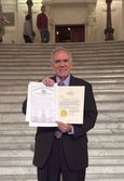 George Whitehair at PA state capitol with certificates