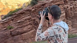 wildlife photography_Phil holding binoculars