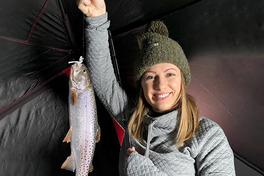 angler holding cutthroat trout