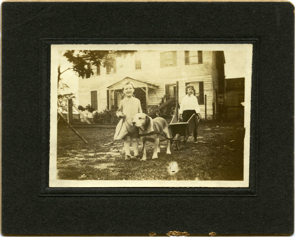 old timey photo of small children with a dog