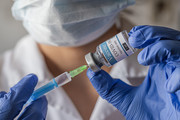 Nurse with COVID-19 Vaccine