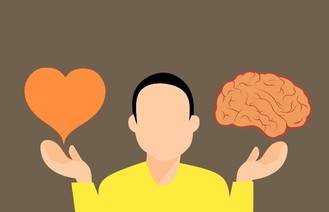Man with a picture of a heart on one side and a brain on the other