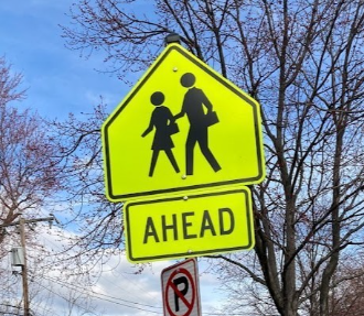 pedestrian crossing that reads "ahead"