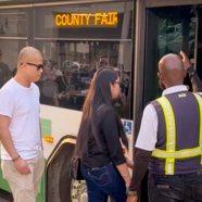 People boarding shuttle to the Fair