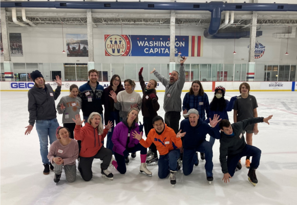 A group of volunteers on the ice rink