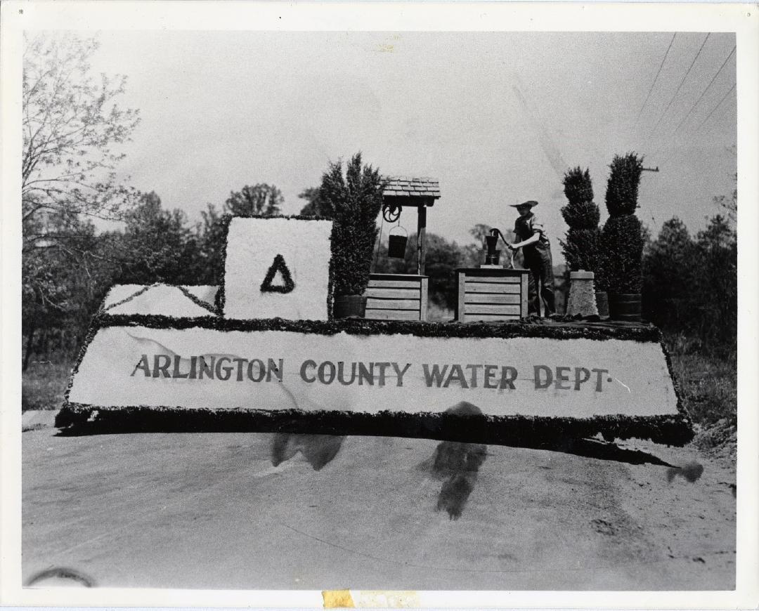 Historical photo of parade float that says Arlington County Water Department