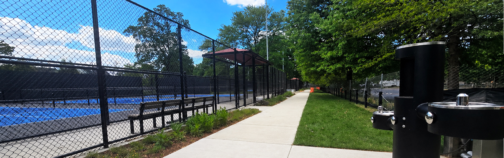 Walkway to courts and drinking fountain at new Walter Reed pickleball courts