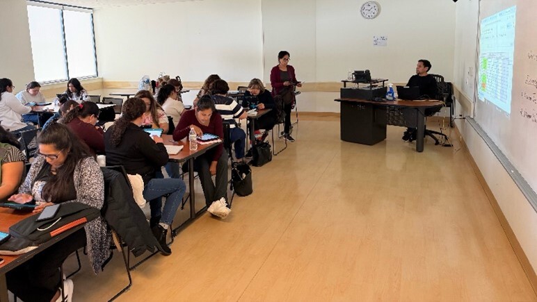 Adults in a classroom.