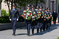 Honor Guard walks with wreaths at the National Law Enforcement Officers Memorial