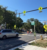 Image of an RRFB signal device mounted to a signal mast arm over S. Pollard Street