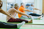 People stretching at a fitness class.