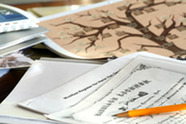Family research papers spread out on a table.