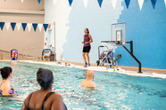 adults participating in an aquatics fitness class