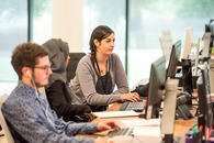 People using a computer indoors