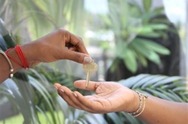 A hand that is giving a key to another person