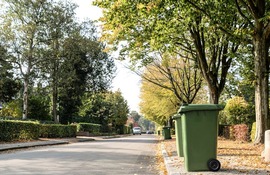 A recycling container left out by the curbside for collection