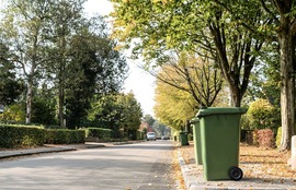 A recycling container left out by the curbside for collection