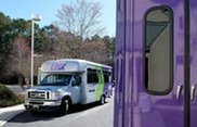 A GRTC LINK microtransit van outside Chesterfield's LaPrade Library
