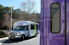 A GRTC LINK microtransit van outside Chesterfield's LaPrade Library