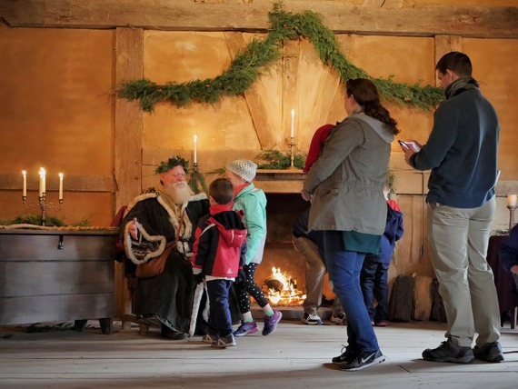 Father Chrismas greeting children at Henricus