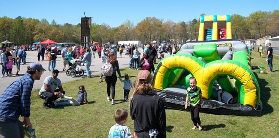 Children play on inflatables in the Kids Zone at Chesterfield Outdoor Fest