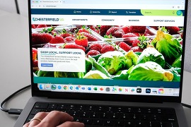 A laptop displaying the home page of the county's website, chesterfield.gov  