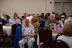 Picture of people enjoying Older American Month luncheon