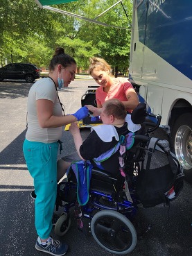Picture of man in a wheelchair getting dental work