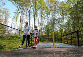 A woman and her daughter use the new connector trail near Chesterfield's Mary B. Stratton Park