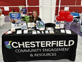 Picture of CER staff at a resource table at National Night Out Event